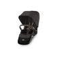 Chocolate brown stroller seat with canopy and padded footrest, side view