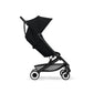 Black stroller in side profile with canopy, padded seat, and round wheel rims