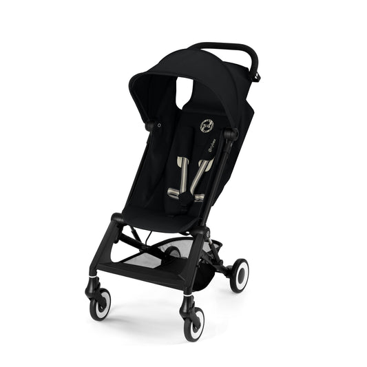 Black compact stroller with canopy, front wheels with suspension, and reclining seat