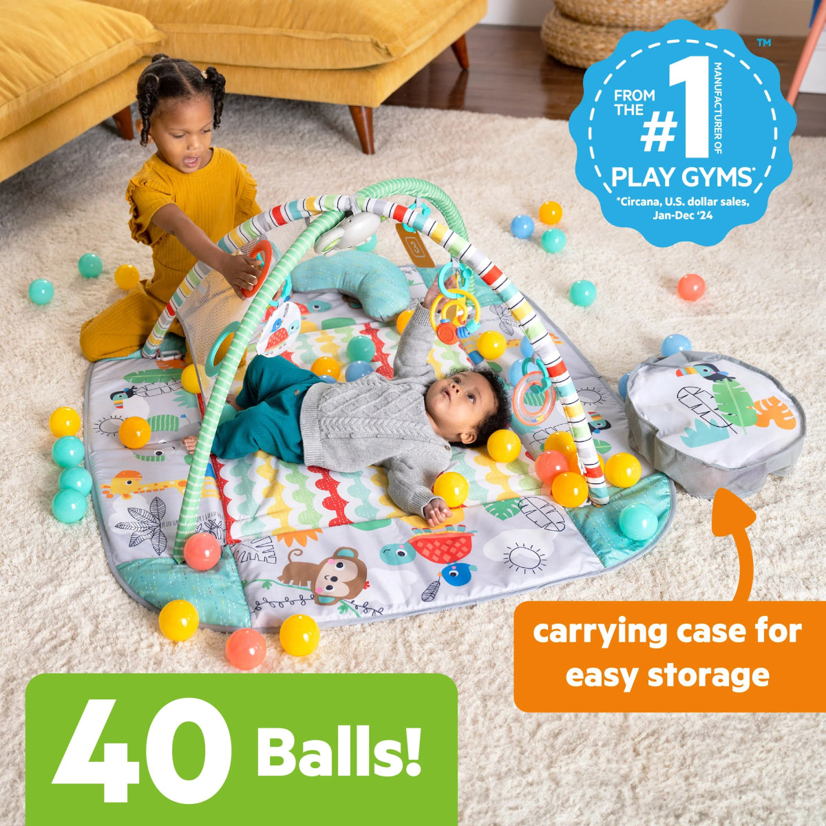 Baby activity mat with colorful balls, animal prints, and tummy-time prop pillow