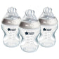 Three clear 260ml baby bottles with beige collar and star logo