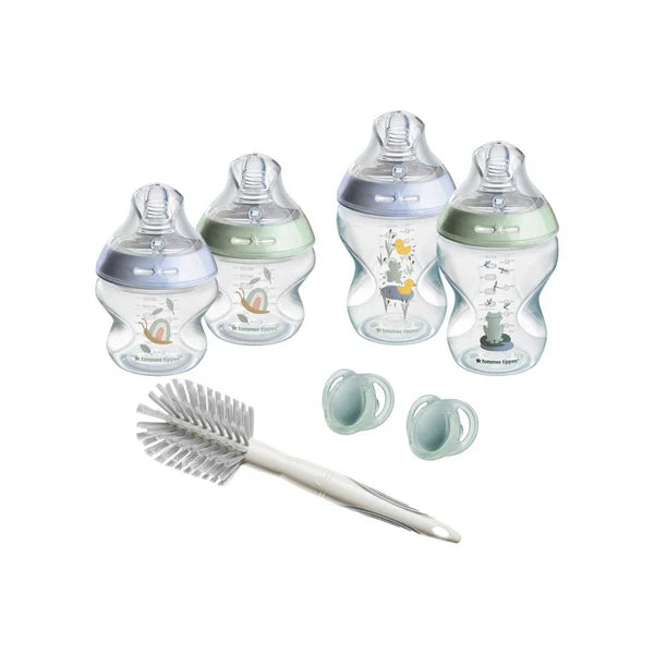 Blue-themed baby bottle set with three bottles, nipple cups, and bottle cleaning brush