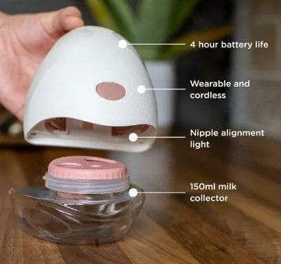 Wearable cordless breast pump with 150 ml milk collector jar, shown in hand
