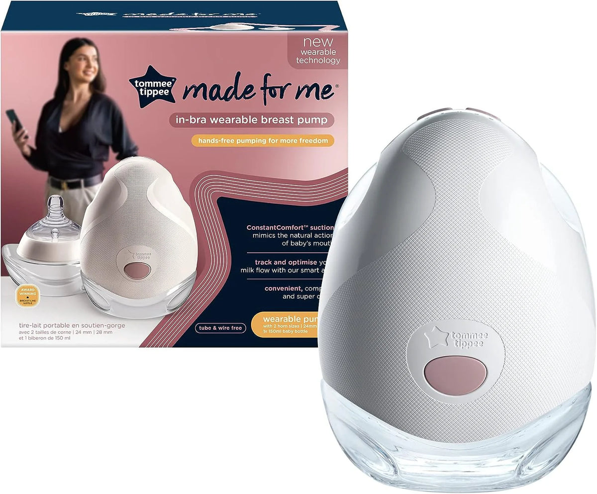 White portable wearable electric breast pump with pink button and textured shell