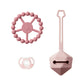 Pink silicone teether ring with star center, pacifier and handled cleaning brush