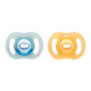 Pair of night-glow silicone baby dummies, teal and amber, one-piece shield