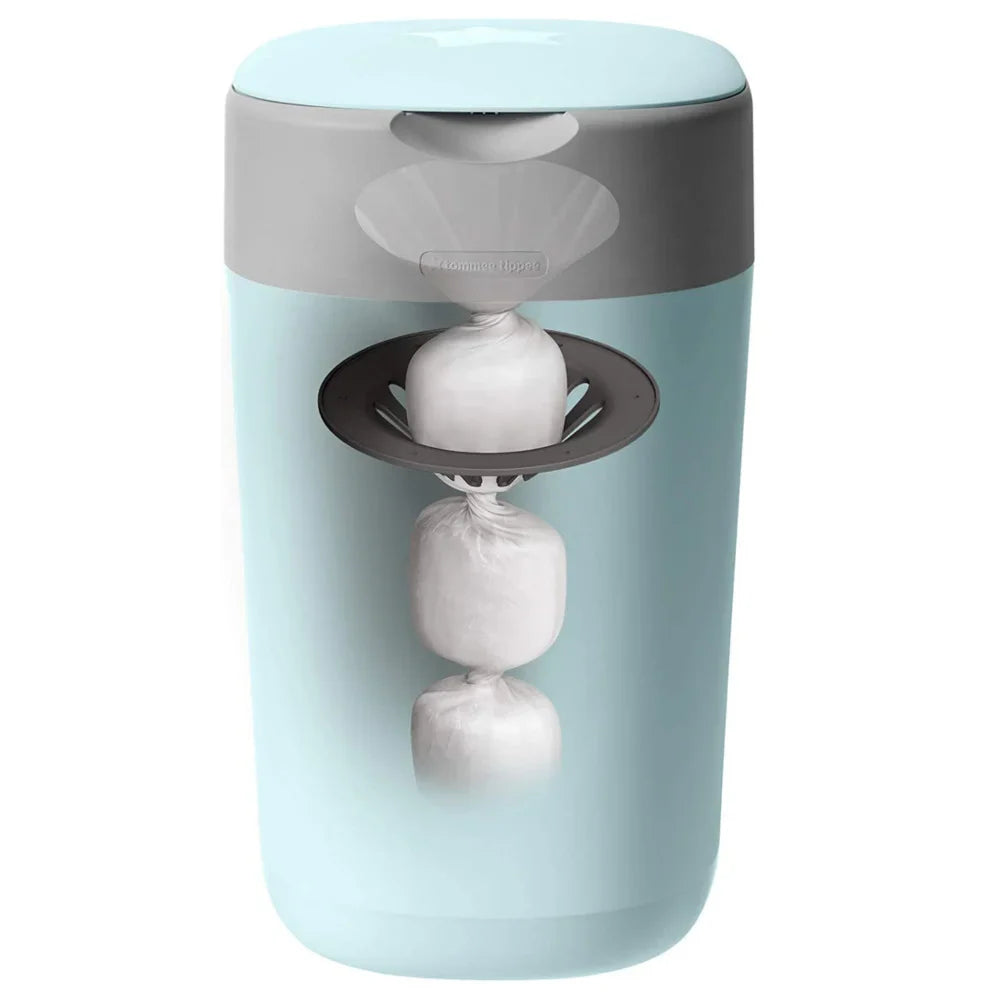Light blue diaper disposal bin with grey lid and open flap holding tied liners