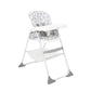 White highchair with light gray icon-pattern seat, curved white tray and support bar.
