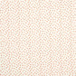 Cotbed fitted sheet fabric with tiny red dot pattern on light cream background