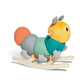 Stuffed rocking caterpillar toy side view, yellow head, teal body, striped gray legs
