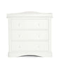 White dresser changer front view with three drawers and decorative top panel