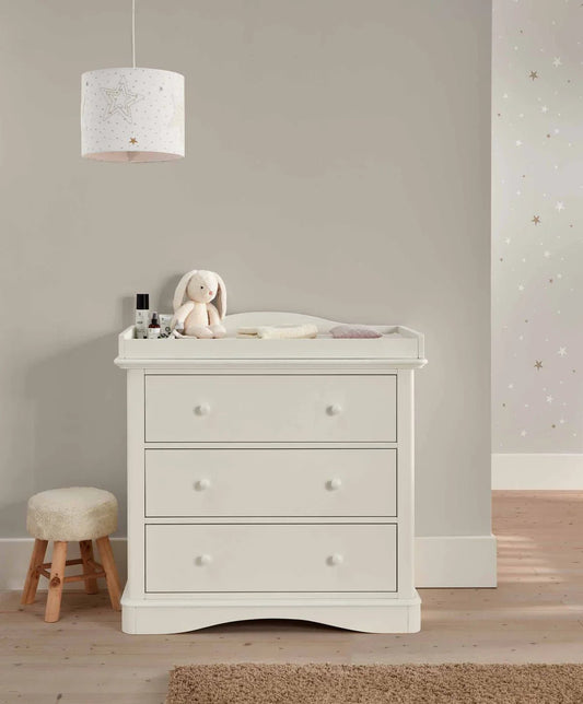 White nursery dresser changer with three drawers and curved top rail