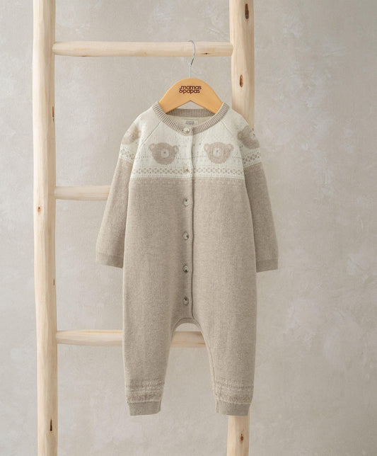 Light beige knitted romper with long sleeves, button front, and teddy bear face motif