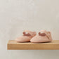 Pink scallop pram shoes with ruffled trim and ankle buckle strap