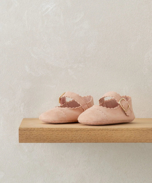 Pink scallop pram shoes with ruffled trim and ankle buckle strap