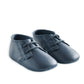 Navy pram shoes with lace-up front and smooth upper