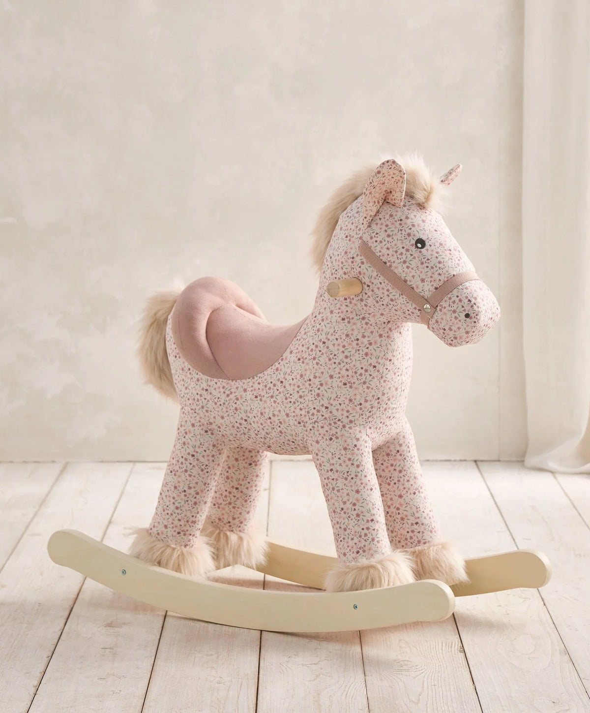 Plush rocking horse toy with ditsy floral print, pink mane, wooden rockers