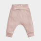 Light pink ribbed leggings with elastic waistband and cuffed ankle openings