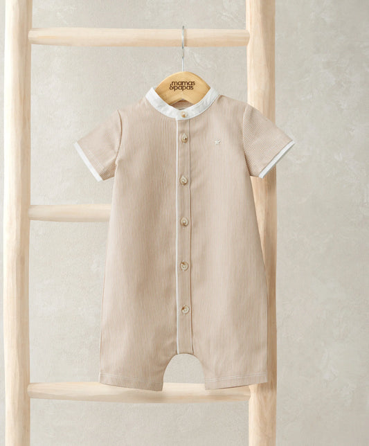 Beige baby romper with short sleeves, round collar, and gold-tone button front