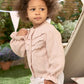 Light pink embroidered button cardigan with textured panels and long sleeves