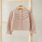 Light pink embroidered cardigan with button front and textured yoke