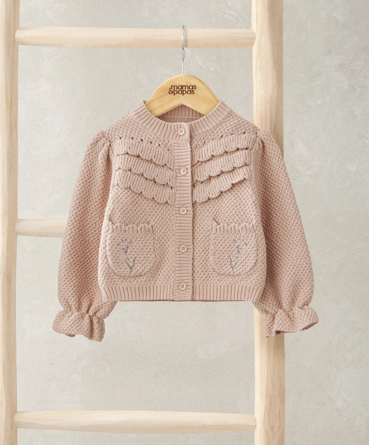 Light pink embroidered cardigan with button front and textured yoke