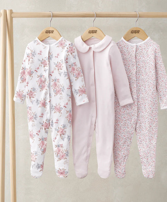 Three long-sleeve sleepsuits: floral white, pale pink, and pink ditsy print