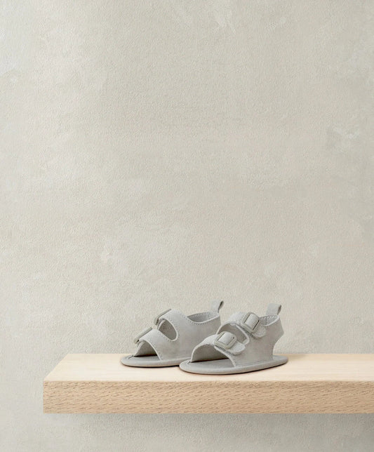 Stone suede sandals in light gray with two adjustable buckle straps, open toe