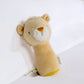 Lion mini rattle plush with tan body, white muzzle, and yellow triangle nose patch