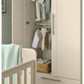 Open cream cashmere wardrobe with hanging rod, hooks, and folded clothes
