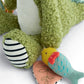 Plush green crocodile toy with striped crinkle ball and colorful fish/leaf tag