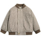 Herringbone bomber jacket in oatmeal with snap buttons, stand collar, and ribbed hems