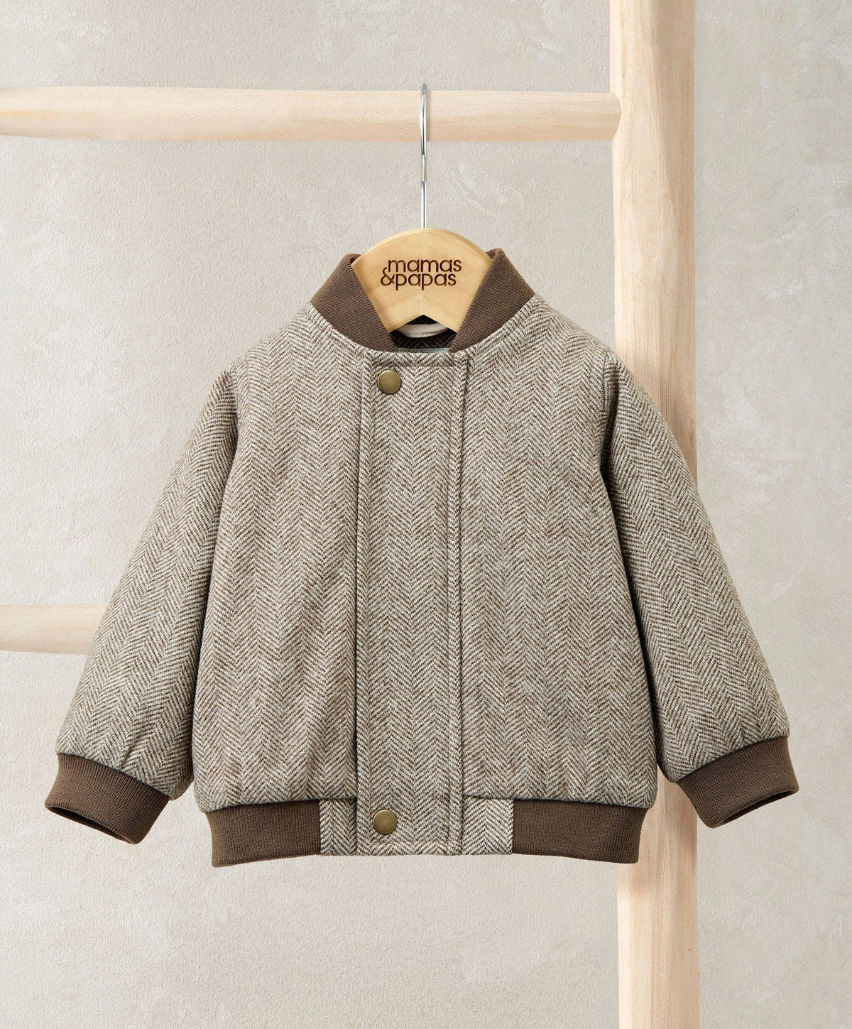 Oatmeal herringbone bomber jacket with ribbed collar, cuffs, and button-front placket