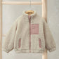 Cream borg jacket on hanger, funnel neck, front zip, chest pocket and side pockets