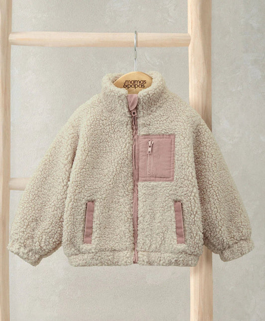Cream borg jacket on hanger, funnel neck, front zip, chest pocket and side pockets