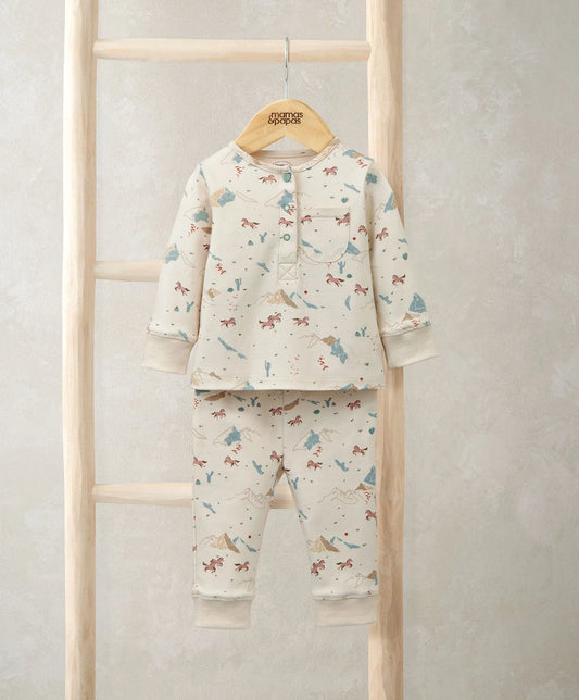 Kids cream pajama set with rodeo-style animal print, long sleeves and pants