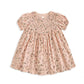 Pink ditsy floral dress with smocked yoke and puff sleeves, gathered skirt