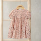 Pink ditsy floral dress with smocked yoke, puff sleeves and gathered skirt