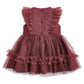 Dusty pink tulle dress with buttoned front bodice and tiered ruffle skirt