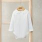 White long-sleeve bodysuit with embroidered Peter Pan collar and scalloped ruffles