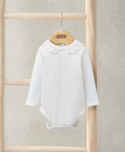 White long-sleeve bodysuit with embroidered Peter Pan collar and scalloped ruffles