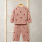 Two-piece knit set with floral pattern: long-sleeve top and matching pants in blush pink