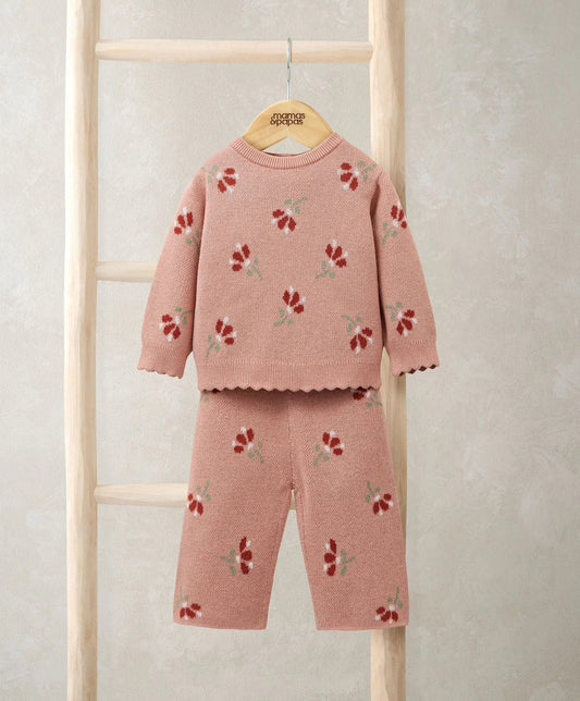 Two-piece knit set with floral pattern: long-sleeve top and matching pants in blush pink