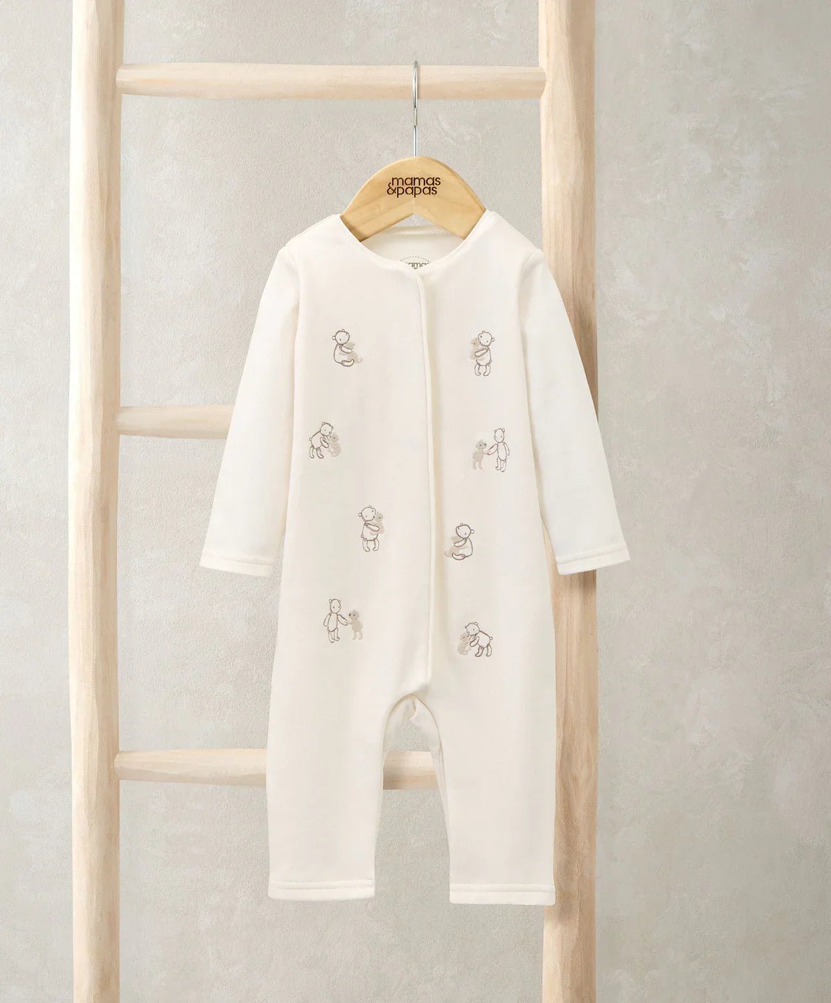 Cream embroidered bear romper, long sleeves with front zip and footed legs