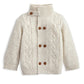 Cream cable knit cardigan with funnel neck and button front, textured cable sleeves