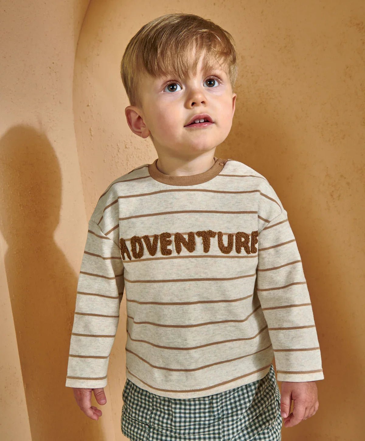 Kids cream striped long-sleeve t-shirt with brown Adventure word graphic, crew neck