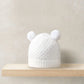 White rib knit beanie hat with pom poms and rounded ear cuffs