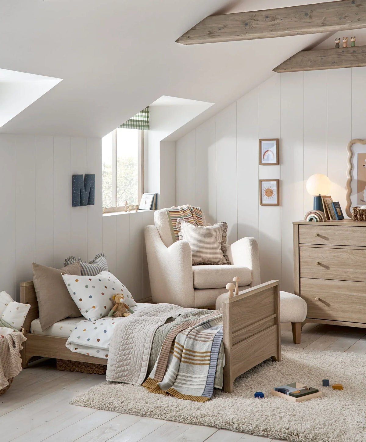 Oak cotbed with open slatted rail and low mattress position