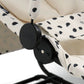 Close-up of black bouncer frame clip on white and black spot seat