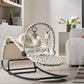 White baby bouncer with black cheetah spot fabric and curved rocking base
